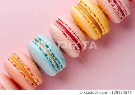 Colorful French Macarons on Pink Background 129324875