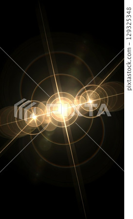 Horizontal row of golden light flares and concentric circles radiating from multiple starbursts on black background 129325348