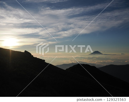 Mount Fuji at sunrise as seen from the summit of Senmai-dake 129325563
