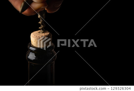 Bottle of wine with corkscrew Bottle of wine with corkscrew 129326304