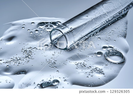 A test tube with spilled serum. Demonstration of the texture. A test tube with spilled serum. Demonstration of the texture. 129326305