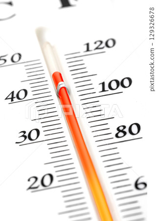 Thermometer measuring high temperature during summer heatwave 129326678