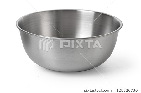 Shiny stainless steel mixing bowl on white surface 129326730