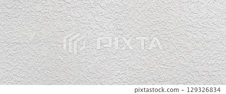White rough plaster wall texture providing detailed background 129326834