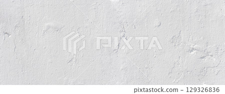 White concrete wall texture showing signs of age and wear 129326836