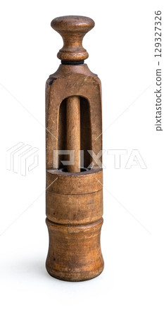 Antique wooden butter pat mold standing on white background 129327326