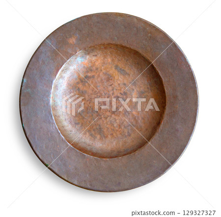 Old hammered copper plate isolated on white background showing patina 129327327