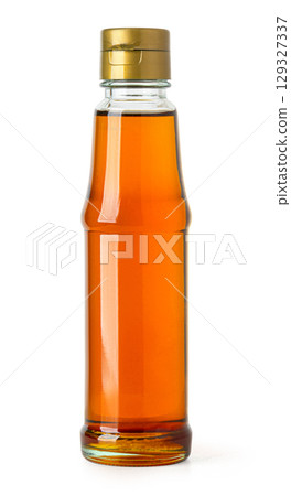 Sesame oil bottle isolated on white background 129327337