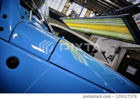 Car Repair Workshop Mechanics Working with Parts 129327378