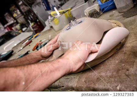 Car Repair Workshop Mechanics Working with Parts Car Repair Workshop Mechanics Working with Parts 129327383