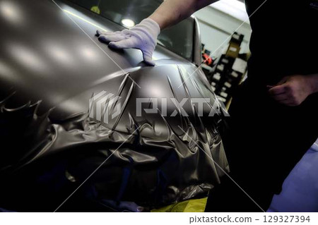 Car Repair Workshop Mechanics Working with Parts 129327394