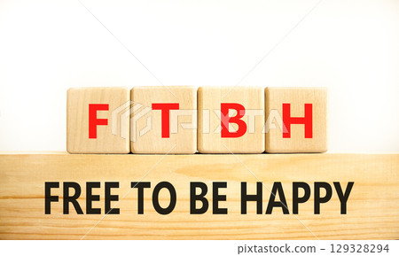 FTBH Free To Be Happy symbol. Concept word FTBH Free To Be Happy on beautiful wooden blocks. Beautiful white background. Business motivational FTBH Free To Be Happy concept. Copy space. 129328294