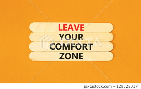 Leave your comfort zone symbol. Concept words Leave your comfort zone on beautiful wooden stick. Beautiful orange paper background. Business psychological Leave your comfort zone concept. Copy space. Leave your comfort zone symbol. Concept words Leave your comfort zone on beautiful wooden stick. Beautiful orange paper background. Business psychological Leave your comfort zone concept. Copy space. 129328317
