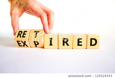 Retired or expired symbol. Concept words Retired Expired on wooden cubes. Beautiful white table white background. Businessman hand. Business and retired or expired concept. Copy space. Retired or expired symbol. Concept words Retired Expired on wooden cubes. Beautiful white table white background. Businessman hand. Business and retired or expired concept. Copy space. 129328343