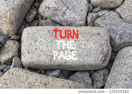 Turn the page symbol. Concept words Turn the page on beautiful grey stone. Beautiful grey mountain stone background. Business motivational lifestyle turn the page concept. Copy space. Turn the page symbol. Concept words Turn the page on beautiful grey stone. Beautiful grey mountain stone background. Business motivational lifestyle turn the page concept. Copy space. 129328360