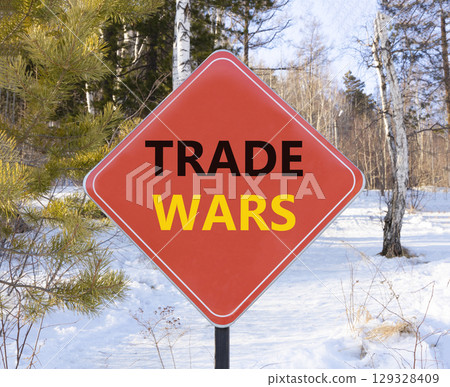 Trade wars symbol. Concept word Trade wars on beautiful red road sign. Beautiful snow winter forest background. Business trade wars concept. Copy space. Trade wars symbol. Concept word Trade wars on beautiful red road sign. Beautiful snow winter forest background. Business trade wars concept. Copy space. 129328409