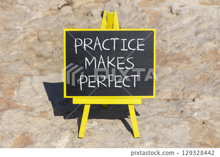 Practice makes perfect symbol. Concept words Practice makes perfect on beautiful black chalk blackboard. Beautiful stone background. Business practice makes perfect concept. Copy space. Practice makes perfect symbol. Concept words Practice makes perfect on beautiful black chalk blackboard. Beautiful stone background. Business practice makes perfect concept. Copy space. 129328442