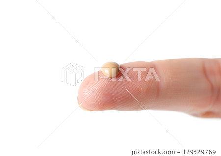 Makeup artist demonstrating foundation swatch on fingertip, product sample isolated on transparent background Makeup artist demonstrating foundation swatch on fingertip, product sample isolated on transparent background 129329769