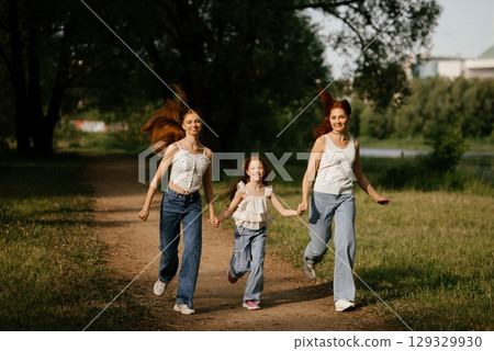 Family Running Together Outdoors on Sunny Day 129329930