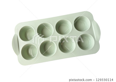 Empty clean silicone mold for baking cakes, muffins, making ice-cream, homemade desserts and pastry, heat-resistant kitchenware, modern trendy equipment, isolated image, clipping path, soft focus 129330114