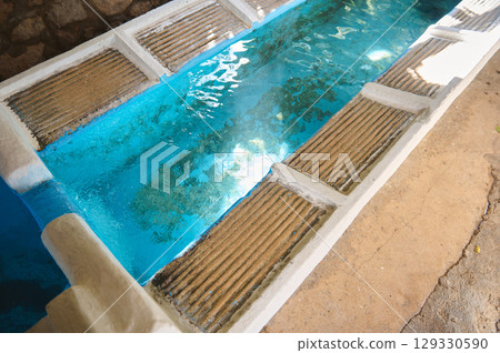 Clear Water in Rustic Trough for Traditional Washing in Sunshine 129330590