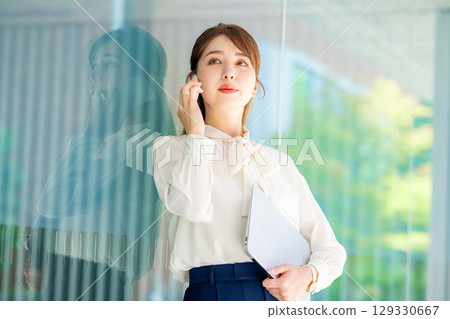 business woman talking on smartphone 129330667