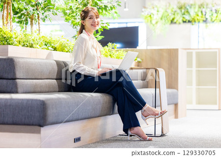 Woman working in coworking space 129330705