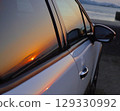 Sunset reflected in the car 129330992