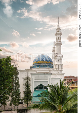 Al-Bukhari Foundation Mosque, Kuala Lumpur, Malaysia. Blue dome and white minarets under a cloudy sky 129331298