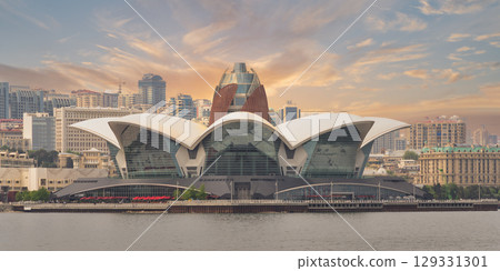 Deniz Mall, a modern architectural landmark on the waterfront in Baku, Azerbaijan, at dusk Deniz Mall, a modern architectural landmark on the waterfront in Baku, Azerbaijan, at dusk 129331301