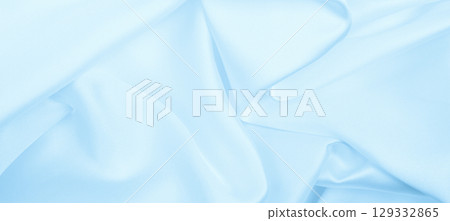 Smooth elegant blue silk or satin luxury cloth texture as abstract background. Luxurious background design Smooth elegant blue silk or satin luxury cloth texture as abstract background. Luxurious background design 129332865
