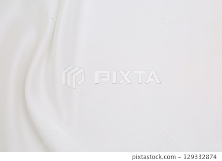 Smooth elegant white silk or satin luxury cloth texture as wedding background. Luxurious background design 129332874