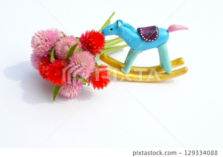 Paper clay rocking horse and globe amaranth New Year's materials 129334088