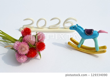 Paper clay rocking horse and globe amaranth New Year's materials 129334090