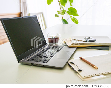 Laptop, binder, sales slip Laptop, binder, sales slip 129334102