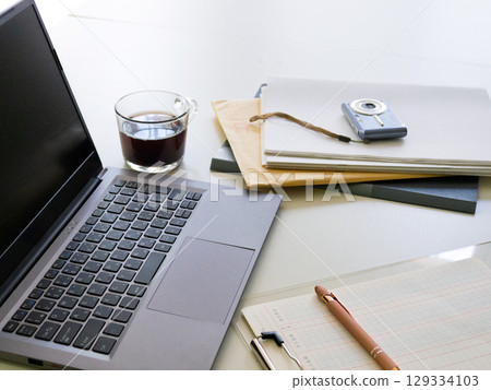 Laptop, binder, sales report Laptop, binder, sales report 129334103