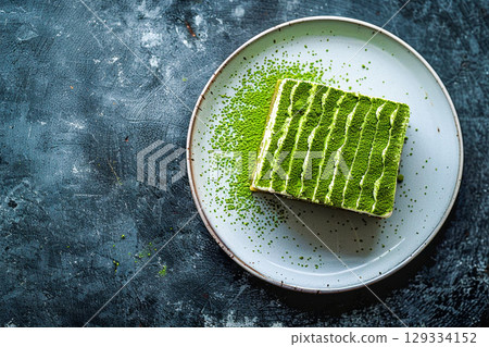 A slice of traditional Japanese matcha cake 129334152
