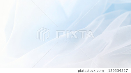 Elegant background with soft blue tulle fabric Elegant background with soft blue tulle fabric 129334227
