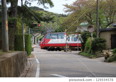 Trains passing through a railroad crossing - Meitetsu trains near Fujikawa-juku 129334578