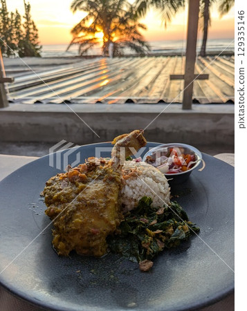 Cafe and Indonesian cuisine overlooking the sunset in Kuta, Bali Cafe and Indonesian cuisine overlooking the sunset in Kuta, Bali 129335146