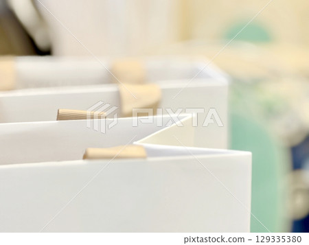 Image of a paper bag containing wedding favors 129335380