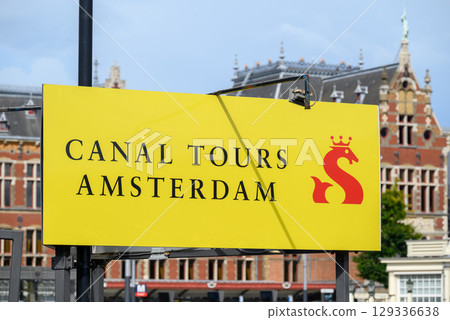 Canal tours Amsterdam, popular tourist sightseeing of old town Amsterdam with its iconic canals, in Amsterdam, Netherlands Canal tours Amsterdam, popular tourist sightseeing of old town Amsterdam with its iconic canals, in Amsterdam, Netherlands 129336638