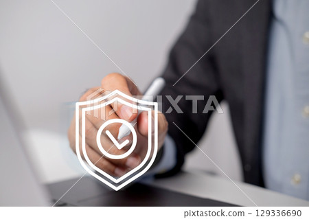 Businessman uses digital pencil to enter code to protect business and financial data with cloud computing system. Businessman uses digital pencil to enter code to protect business and financial data with cloud computing system. 129336690