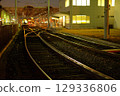 Tram running through the city at night 129336806