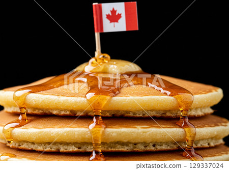 Delicious Pancakes with Maple Syrup and Canadian Flag 129337024