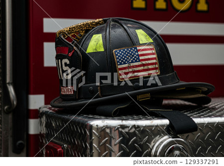 American Firefighter Helmet on Truck 129337291