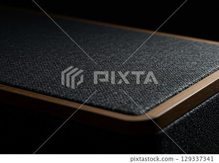 Closeup of Black Speaker with Wood Trim 129337341