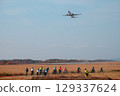 Cycling while watching the planes 129337624