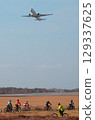 Cycling while watching the planes 129337625