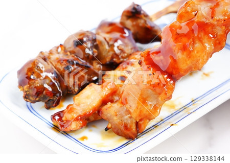 Yakitori - A delicious assortment of yakitori (negima, thigh, and liver) 129338144